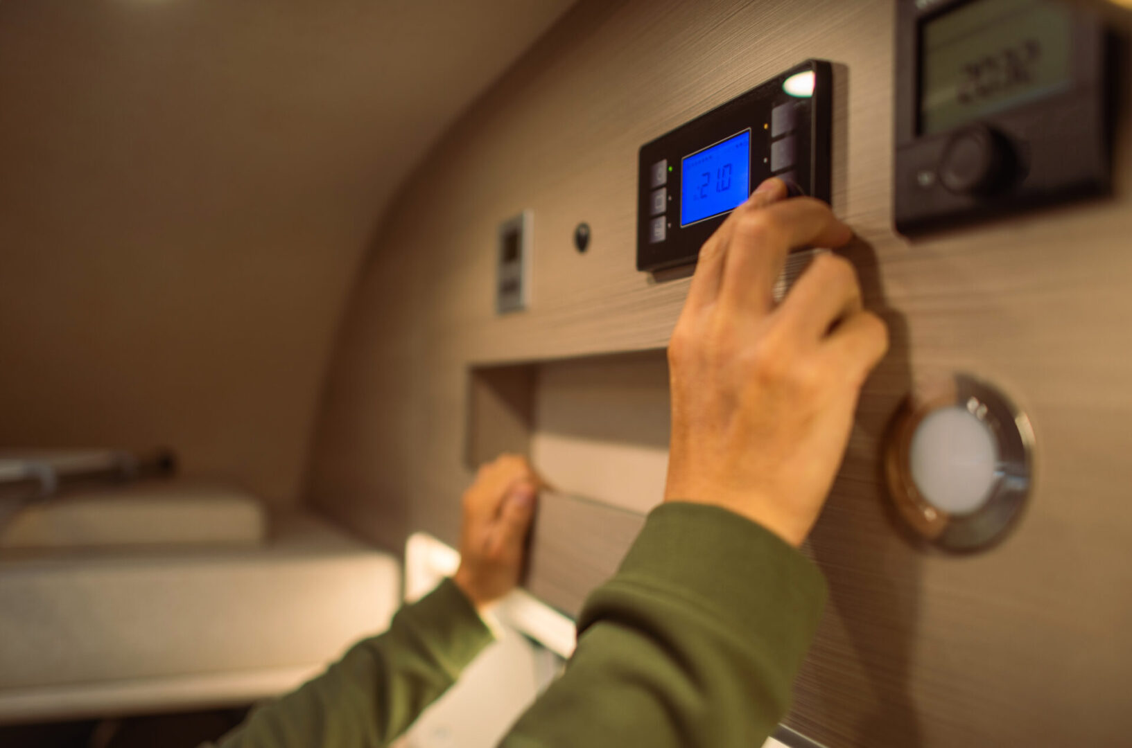 Men Adjusting Interior RV Camper Van Temperature